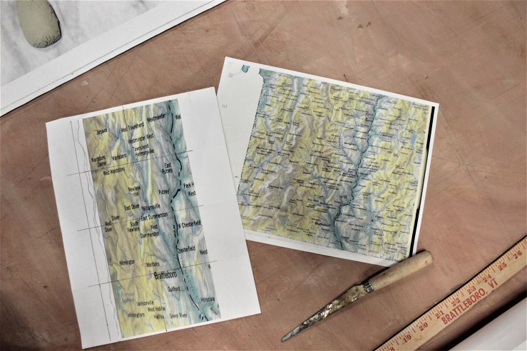 Maps of Brattleboro area on drafting board.