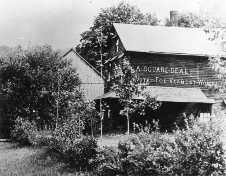 A painted sign on side of barn reads "A Square Deal - Votes For Vermont Women"